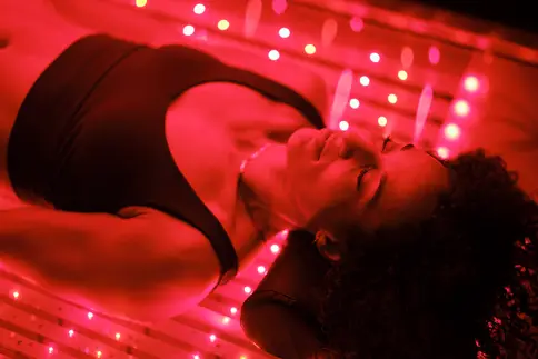 photo of woman on LED bed receiving red light therapy