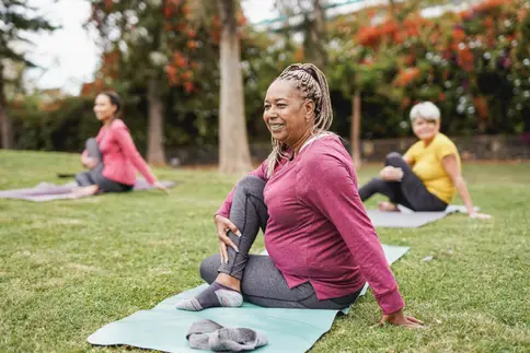 photo of woman doing yoga in park