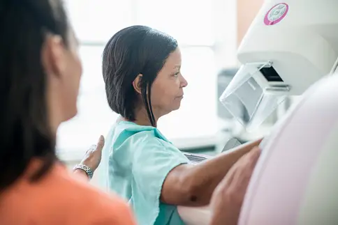 photo of woman undergoing mammogram