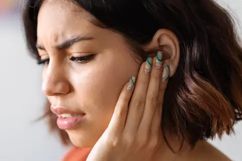photo of woman with ear pain