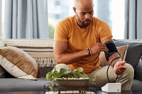 photo of man checking blood pressure