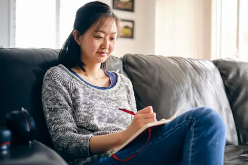 photo of Woman Writing in a Journal