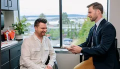 Dr. Higgins Consulting a Patient