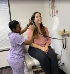 Dr. Melville with a patient.