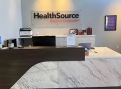 Inside the HealthSource practice, office staff receptionist desk where patients are greeted.