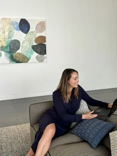 Her feline coworkers—two curious cats—often make surprise appearances during video visits