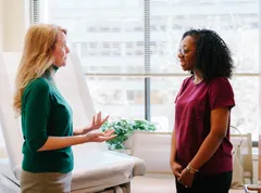Dr. Adrienne Lafleur attentively listening and providing quality care at Complete Concierge Care