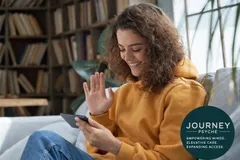 Patient using telehealth psychiatry services on a smartphone, accessing mental health care and medication management remotely.