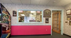 Patient check-in & lobby area with arcade game at Northeast Pediatric Dental