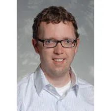Andrew J Mills
