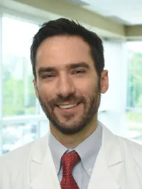 Carl E Manzo