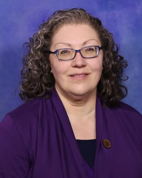 Carol L Opheikens