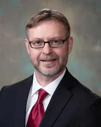 Andrew M Guminski