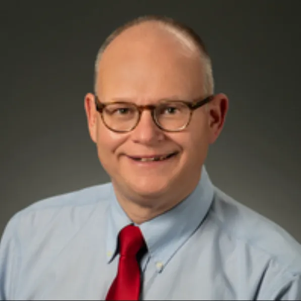Christopher G Koman