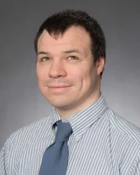 Adam M Gleason