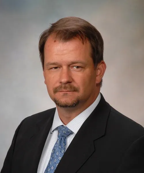 Kevin M Barrett