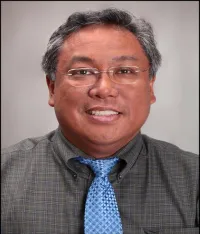 Eric M Toloza