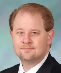 Justin R Walzl