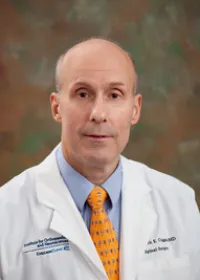 Mark E. Coggins