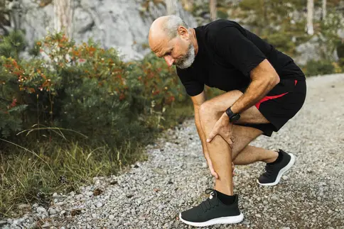 photo of senior man with leg pain