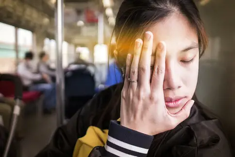 photo of tired woman on train