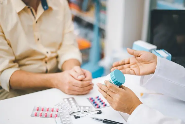 photo of doctor explaining medication to patient