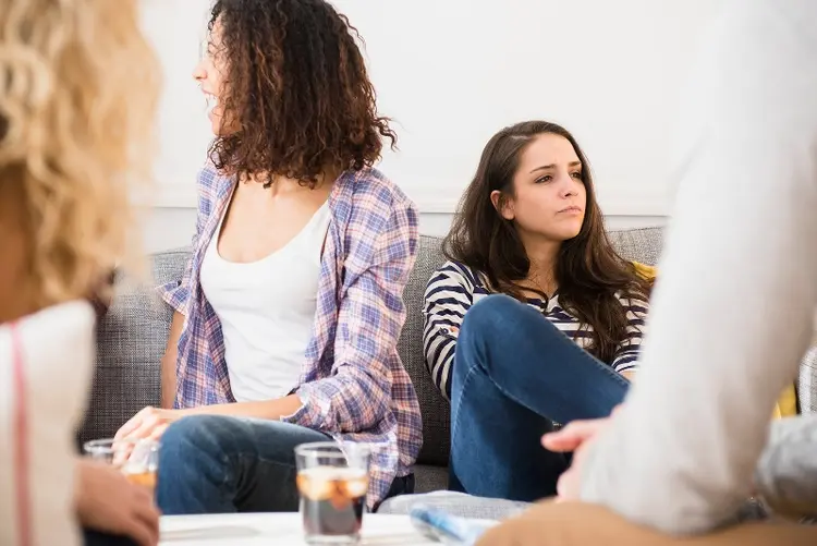 young woman feeling lonely at party