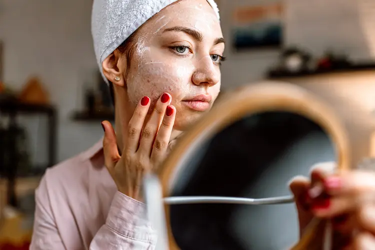 photo of applying cream on acne