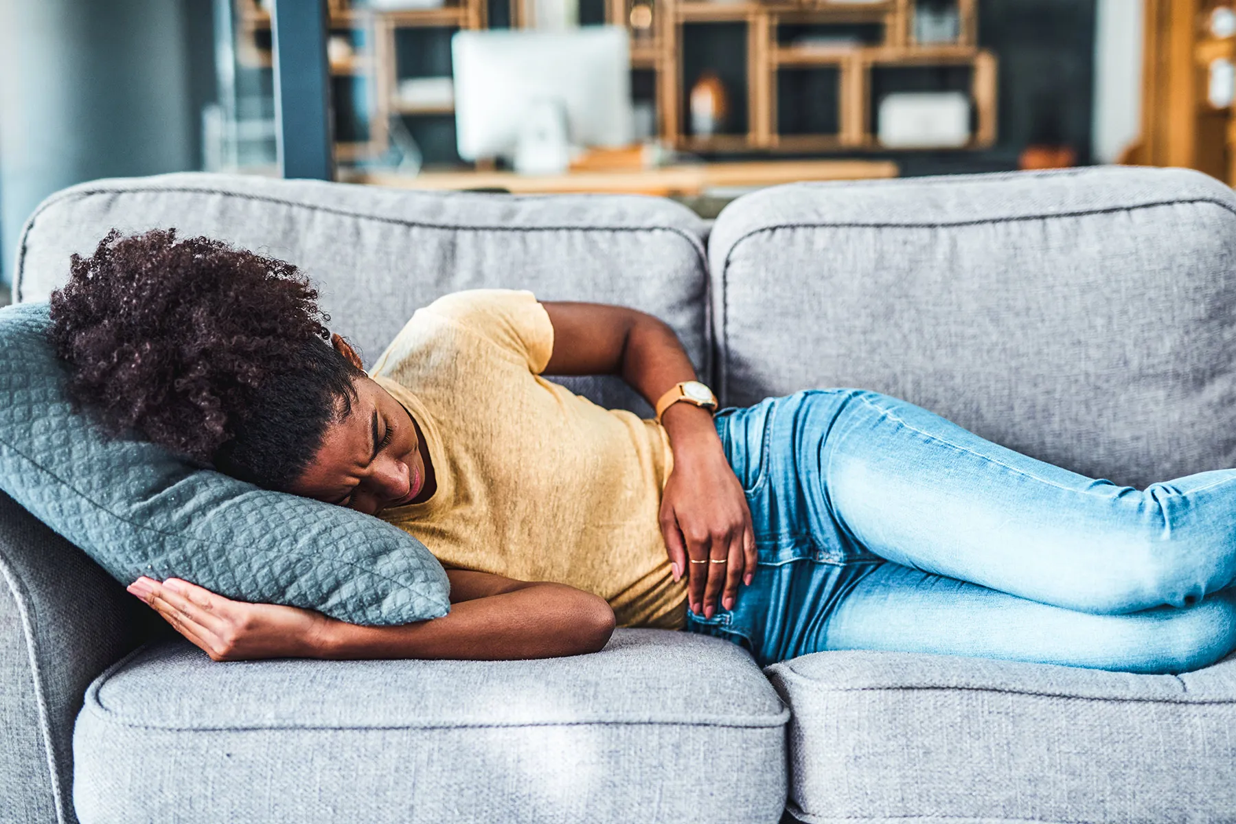 photo of  woman experiencing stomach pain