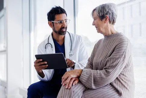 photo of Doctor and patient in conversation