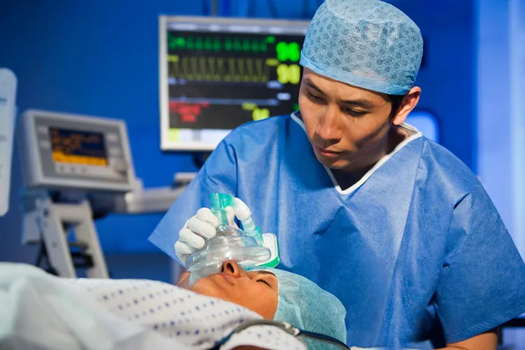 photo of Anesthesiologist administering anaestheti