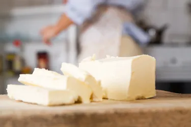 Butter can be a source of vitamins A, D, and E, but its health benefits are debated. (Photo credit: E+ / Getty Images)