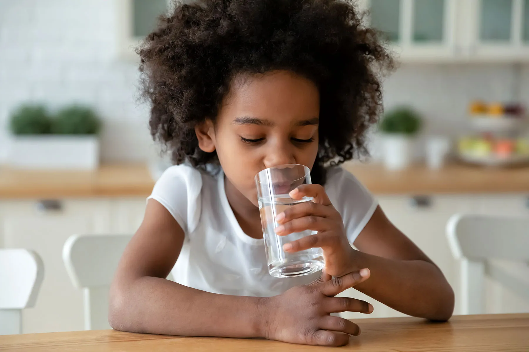 photo of child drinking water