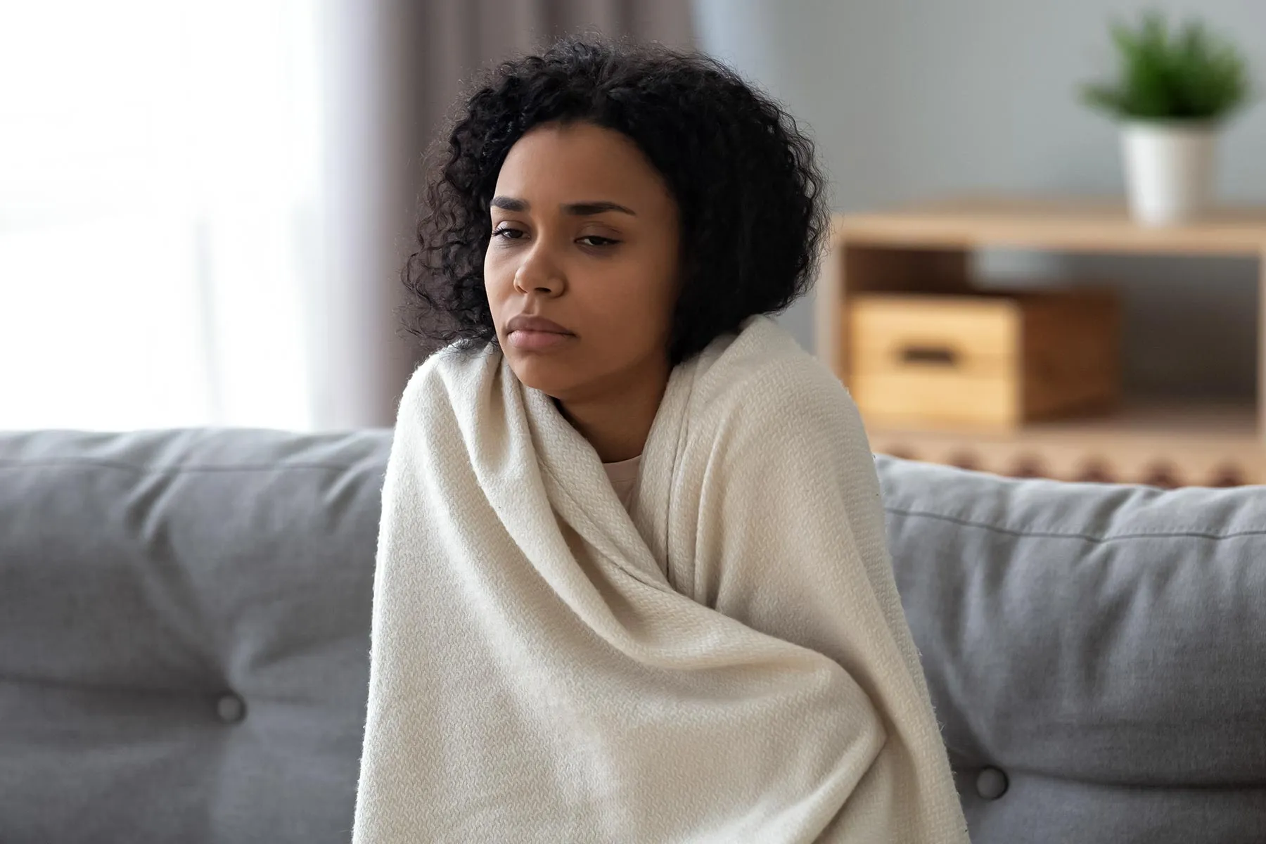 photo of african woman feeling cold 