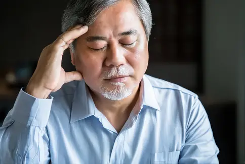 photo of man with headache