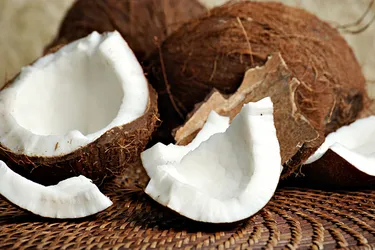 The brown shell of the coconut is called the endocarp. The hairy layer is called the mesocarp. (Photo credit:  Moment/Getty Images)