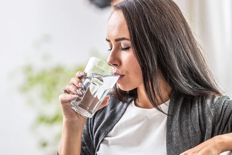 photo of woman is drinking water