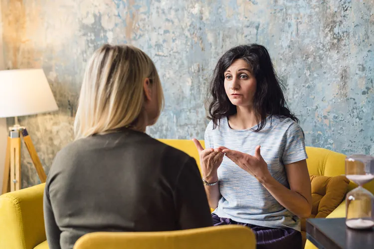 photo of woman talking to therapist