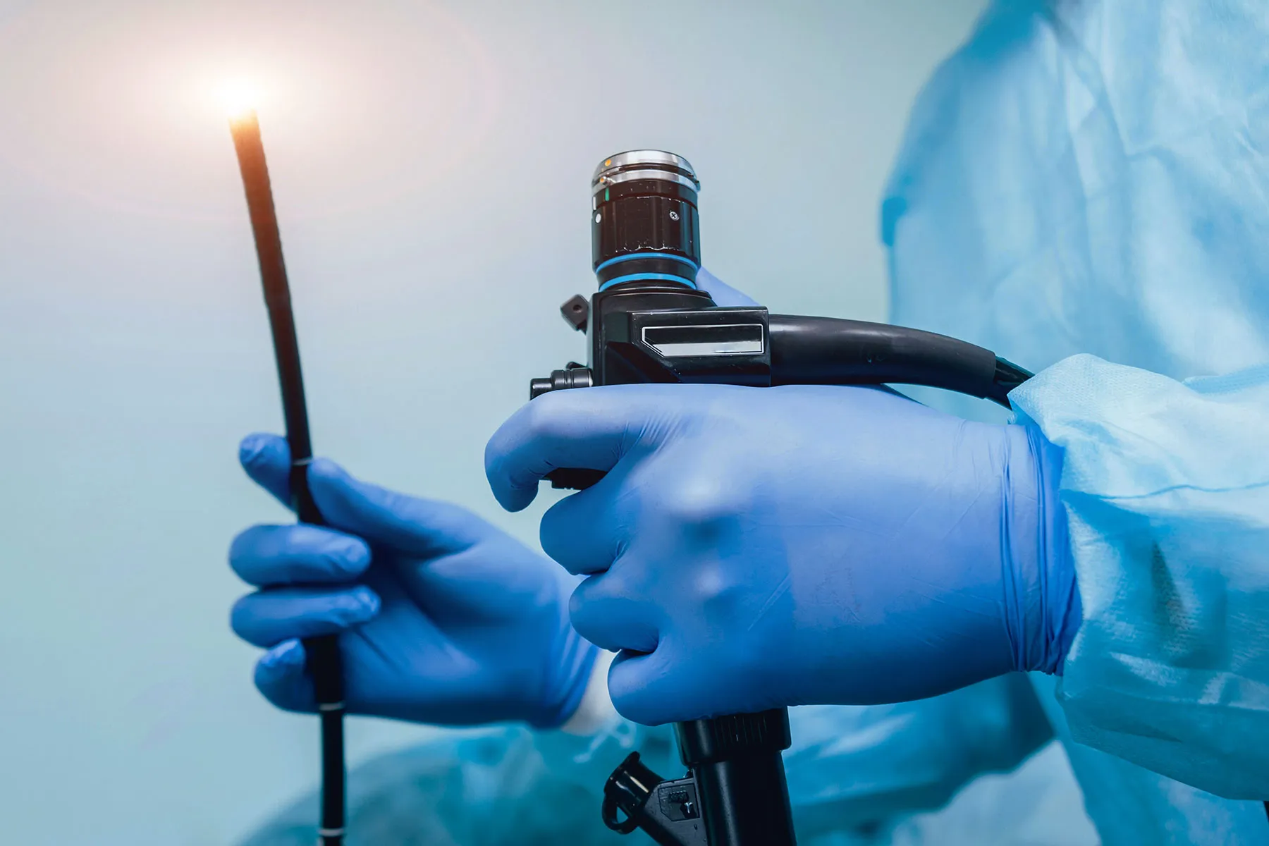 photo of Doctor holding endoscope