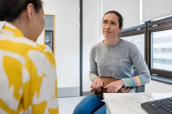 photo of concerned woman talking with doctor