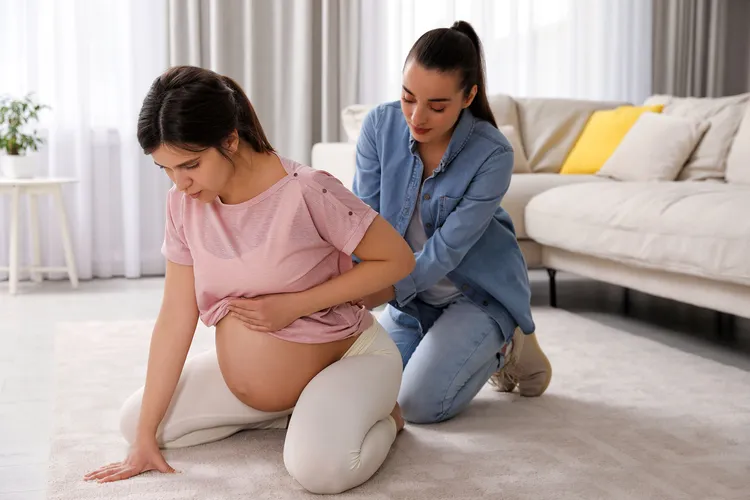 photo of Doula working with pregnant woman