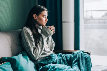 The air inside your home during the winter can leave your skin, sinuses, and throat dry. Avoid colds and chapped skin by adding moisture. (Moment RF/Getty Images)
