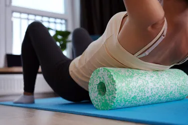 Using a foam roller may help you release tension caused by fascia. (Photo credit: iStock/Getty Images)