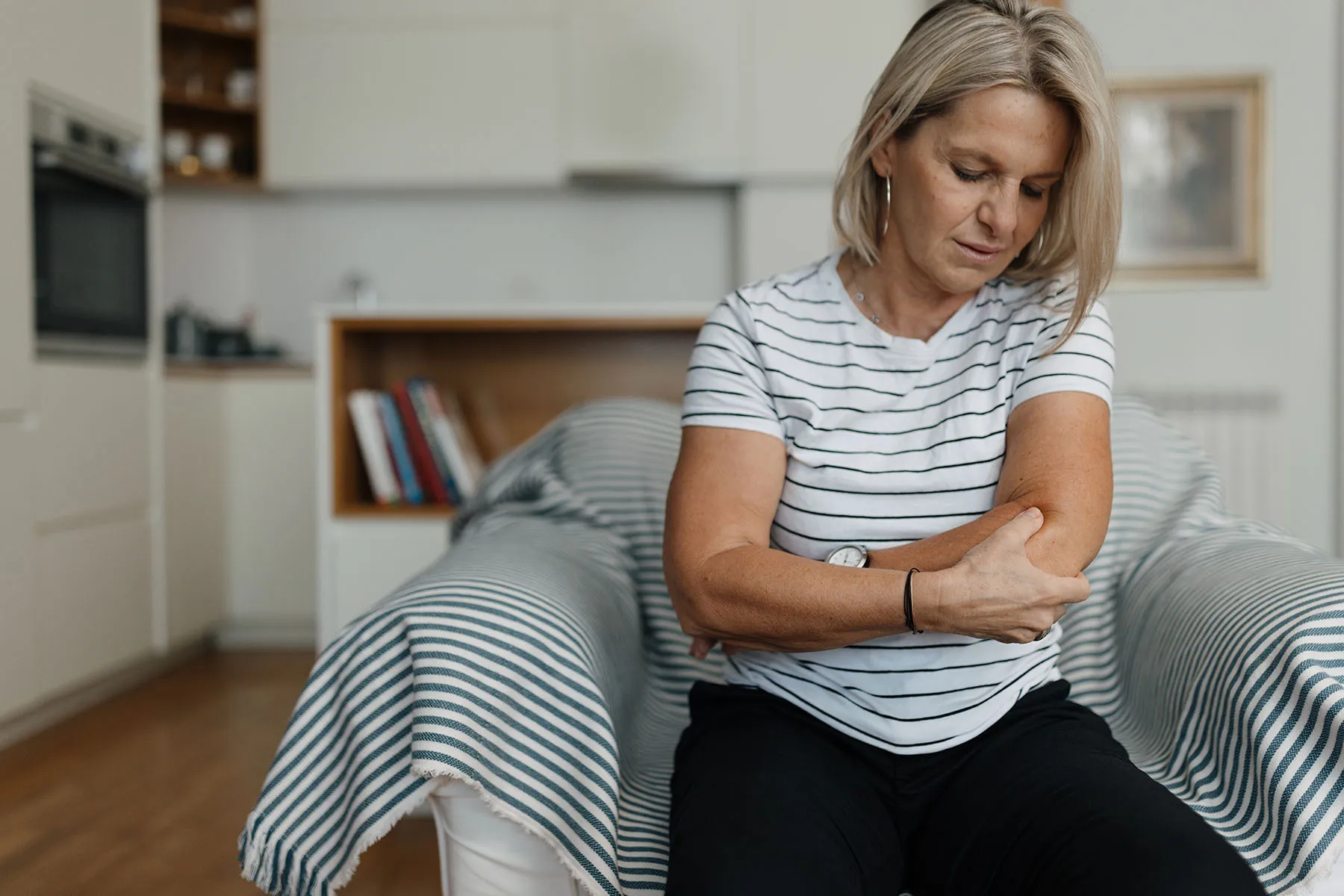 photo of woman with arm pain