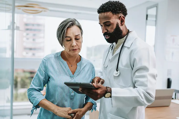 photo of  Doctor talking to patient 