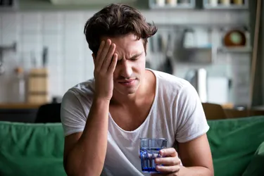 While the only way to completely avoid a hangover is to not drink alcohol, you can get some symptom relief with a few remedies. (Photo Credit: Fizkes/Dreamstime)