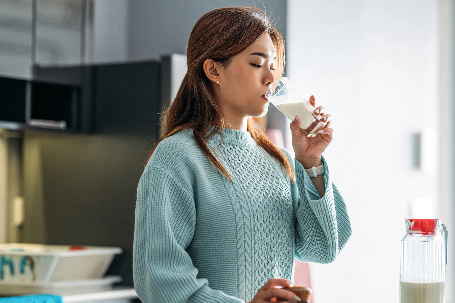 photo of  woman enjoy drinking milk