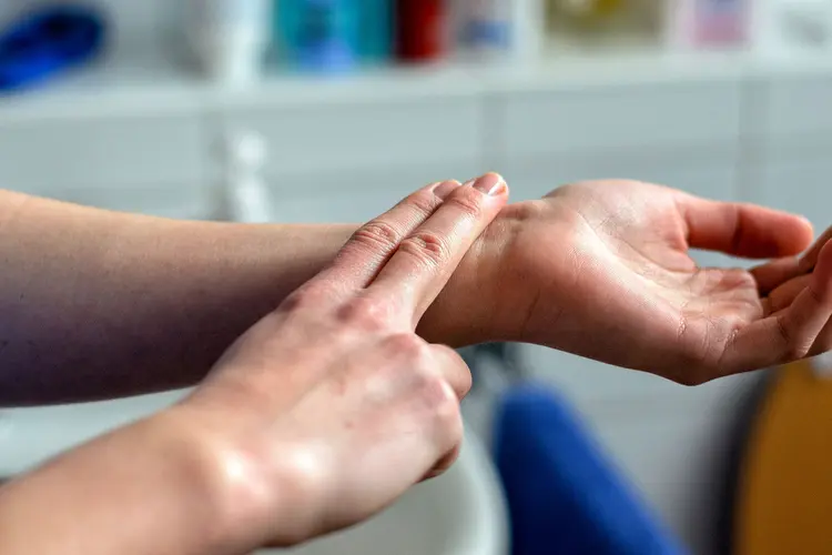 photo of woman checking her pulse