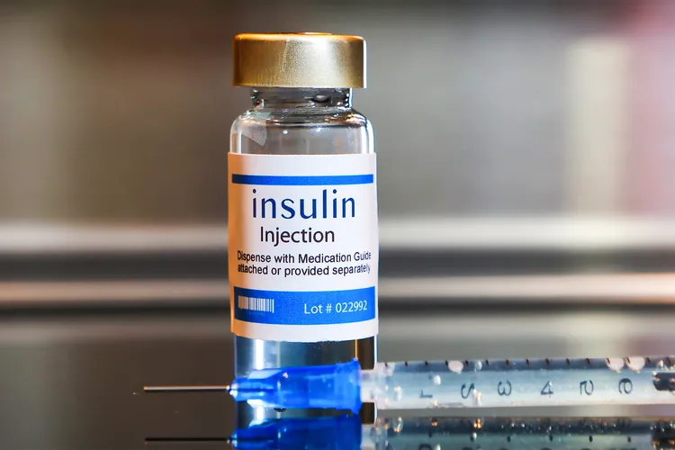photo of Bottle of Insulin injection with a syringe 