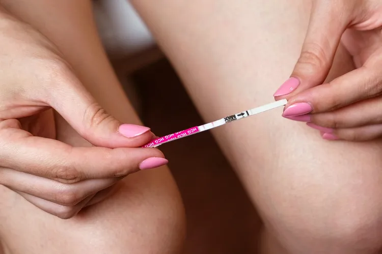 photo of checking ovulation test strip